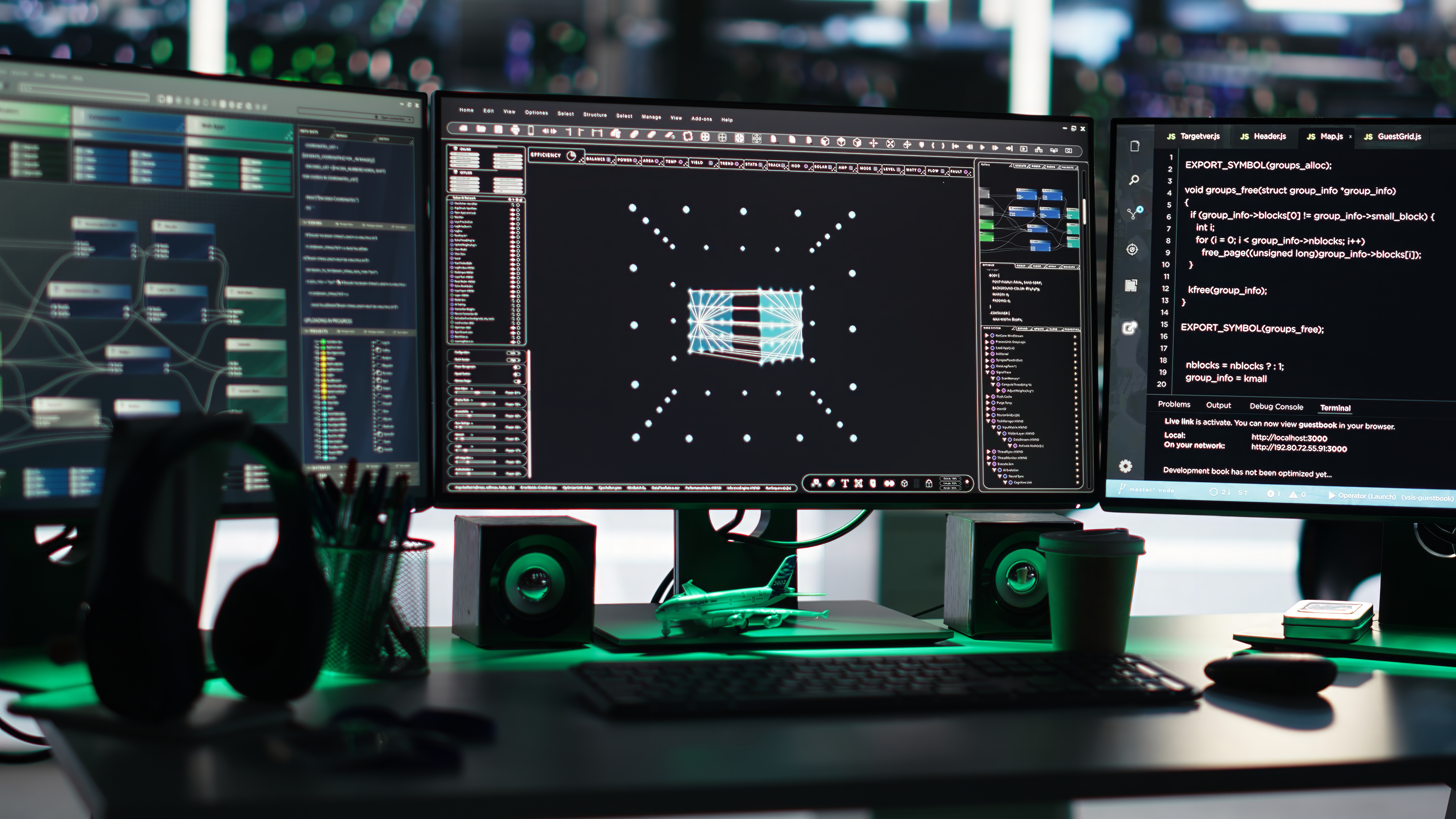 Close-up of dark green velvet dining chairs around a white table with decorative accents